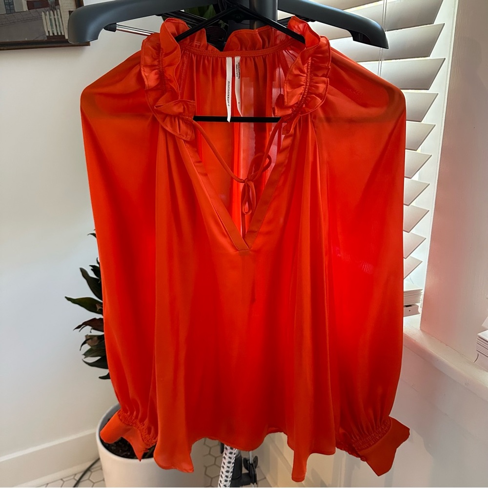 Tangerine silky pullover blouse from Anthropologie